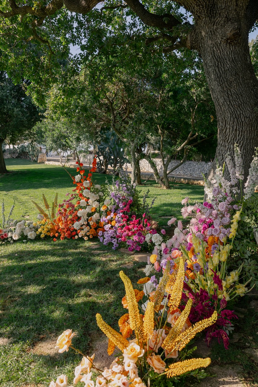 colorful flowers grounded floral arch for symbolic ceremony