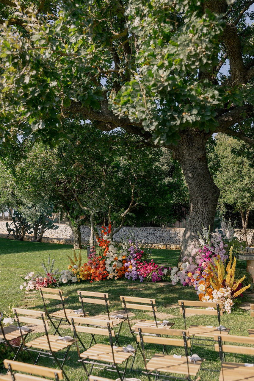 grounded floral arch with color block flowers for symbolic wedding