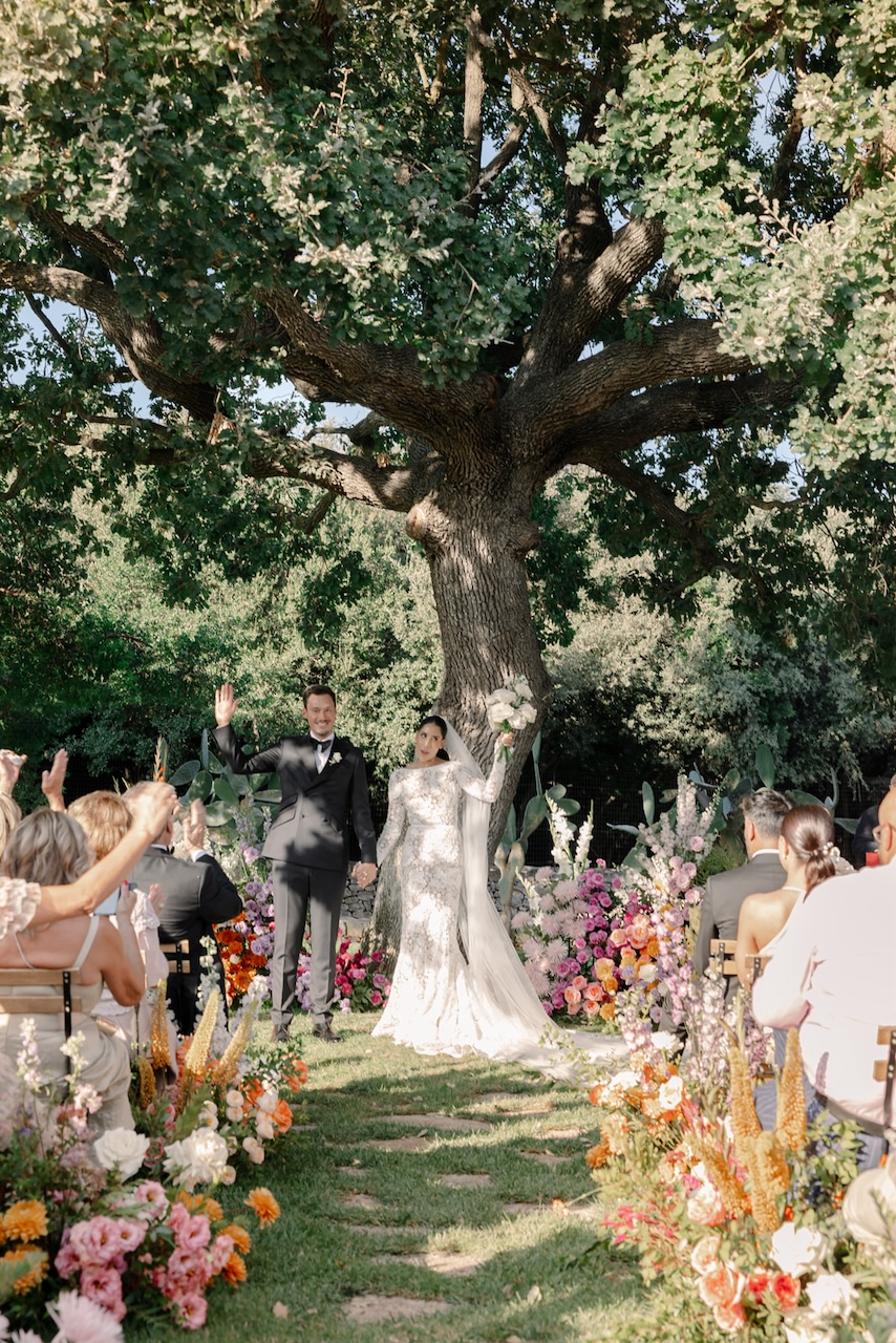 wedding aisle with spontaneous colorful flowers growths