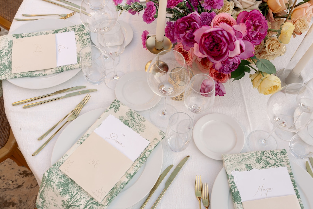 table setup with colorful flowers centerpiece