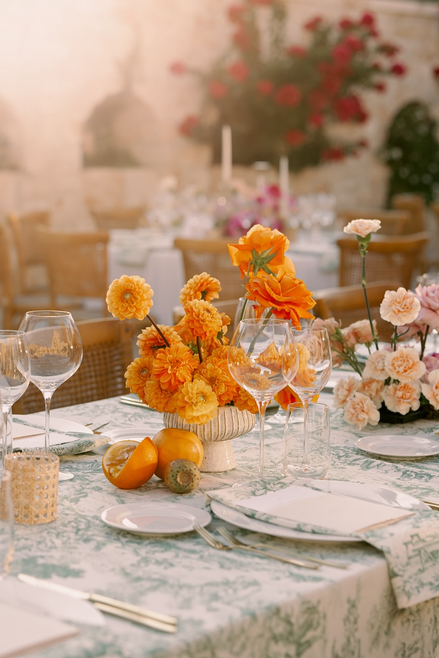 orange carnation and roses centerpieces for indian wedding at Masseria Grieco