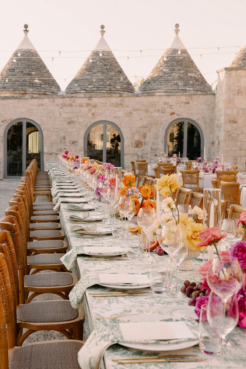 colorful roses and carnation for centerpieces and green toile de jouy tablecloth for indian ceremony