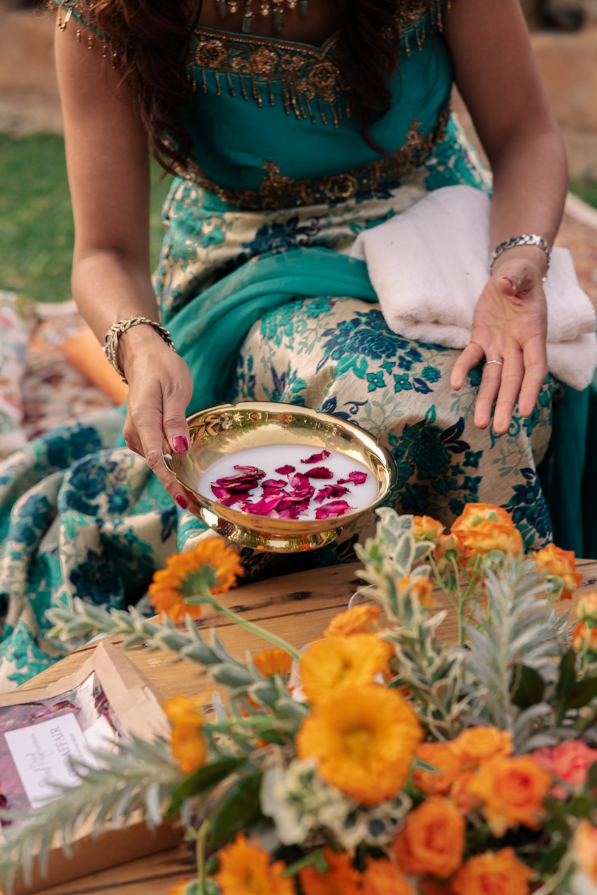 Hindu rituals for wedding with orange flower centerpieces