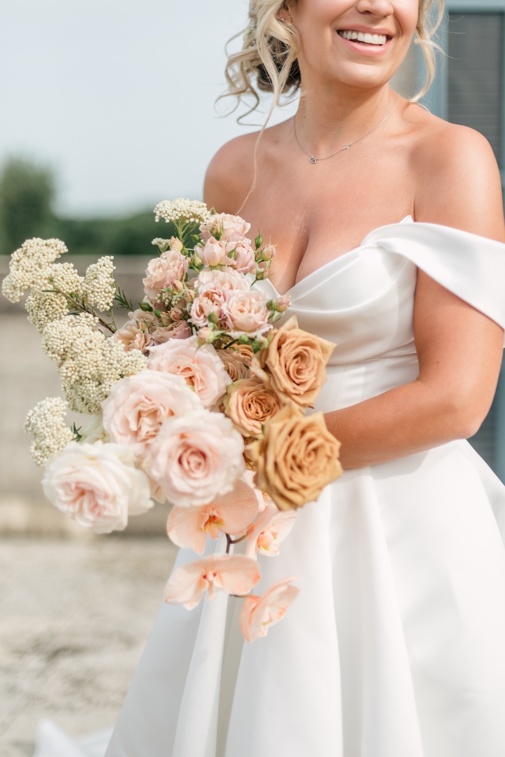 bridal bouquet caramel flowers and peach orchid
